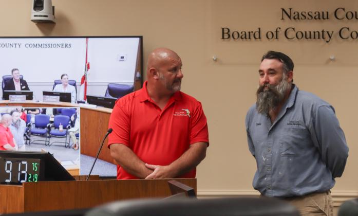 David White, right, was recognized at the Feb. 19 Board of County Commissioners meeting as the county's Employee of the Quarter. On left, Facilities Manager Tony Lombardi. Photo by Ashley Chandler/News-Leader