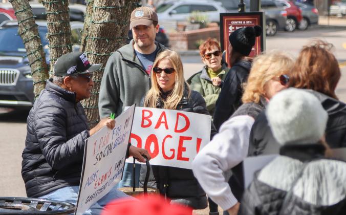 Protesters were Downtown on Thursday to voice their opinion on DOGE, Social Security and Elon Musk to Congressman Aaron Bean and his staff. Photos by Ashley Chandler/News-Leader