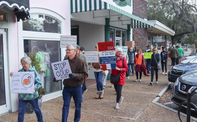 Protesters were Downtown on Thursday to voice their opinion on DOGE, Social Security and Elon Musk to Congressman Aaron Bean and his staff. Photos by Ashley Chandler/News-Leader