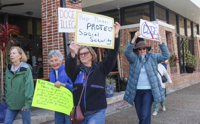 Protesters were Downtown on Thursday to voice their opinion on DOGE, Social Security and Elon Musk to Congressman Aaron Bean and his staff. Photos by Ashley Chandler/News-Leader