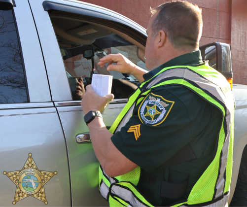 Sgt. Bill Quick accepts a donation at the Valentine’s Day event Hearts and Heroes at the Callahan McDonalds. The McDonald's partnered with the NCSO to raise funds for Special Olympics in conjunction with the NCSO Law Enforcement Torch Run. Submitted photo