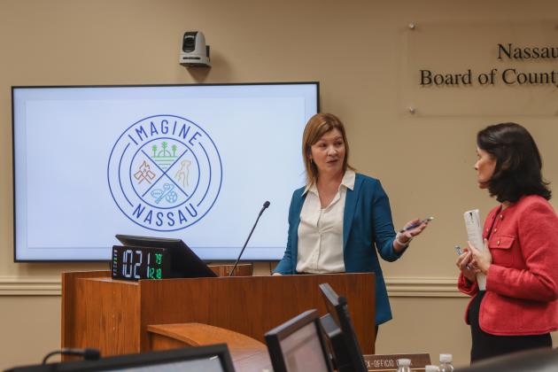 Nassau County Director of Strategic Advancement Brandy Carvalho unveils the logo for Imagine Nassau in December at a Board of County Commissioners meeting. The nonprofit founded by Nassau County will raise funds and apply for grants for projects within Parks &amp; Recreation, Fire Rescue, Animal Services and Conservation and Land Acquisition Management. From left, Carvalho, acting executive director for Imagine Nassau and Assistant County Attorney Abigail Jorandby. Photo by Ashley Chandler/News-Leader