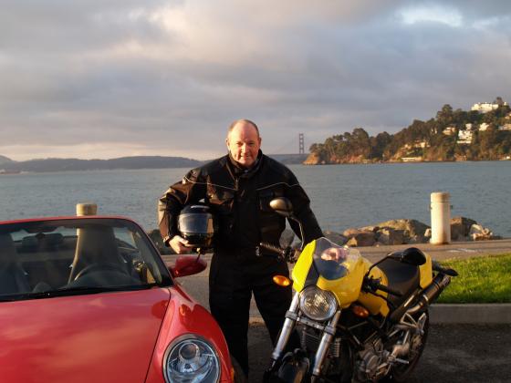 Brian Douglas is pictured with his Porsche 911 roadster and a Ducati MC, in Tiburon, California. Photo by K. Hogan