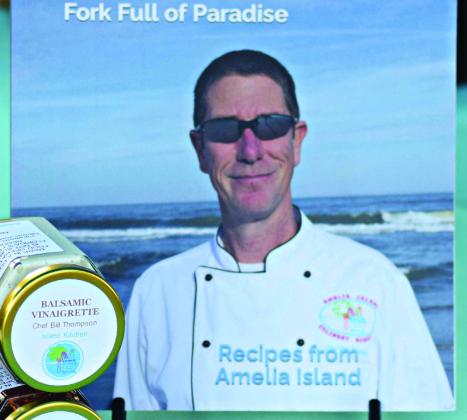 Vendors at the Fernandina Beach Market Place include, Bearded Art and Leather featuring handcrafted leather goods, Holly's Bundt Cakes offering freshly baked treats in various flavors, and Chef Bill Thompson showcasing his unique culinary creations alongside his recipe book. Submitted