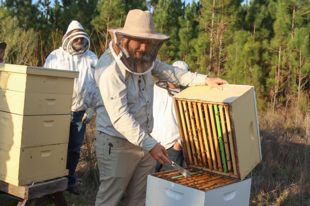 Myron Beachy, president of Nassau County Beekeepers Association, teaches members of the group about beekeeping Feb. 27 at a mentoring session held at the Northeast Florida Fairgrounds. Photo by Ashley Chandler/News-Leader