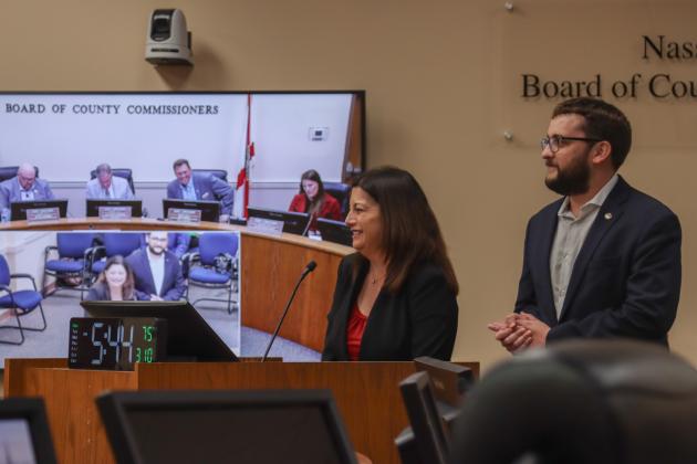 From left, Christina Thomas and Austin Nicklas of the Northeast Florida Builder’s Association, at the March 10 Board of County Commissioners meeting. The board signed a Letter of Support for a state appropriations request that will be used to expand the apprenticeship program. Photo by Ashley Chandler/News-Leader