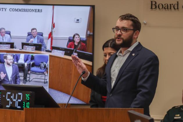 Austin Nicklas of the Northeast Florida Builder’s Association, at the March 10 Board of County Commissioners meeting. The board signed a Letter of Support for a state appropriations request that will be used to expand the apprenticeship program. Photo by Ashley Chandler/News-Leader