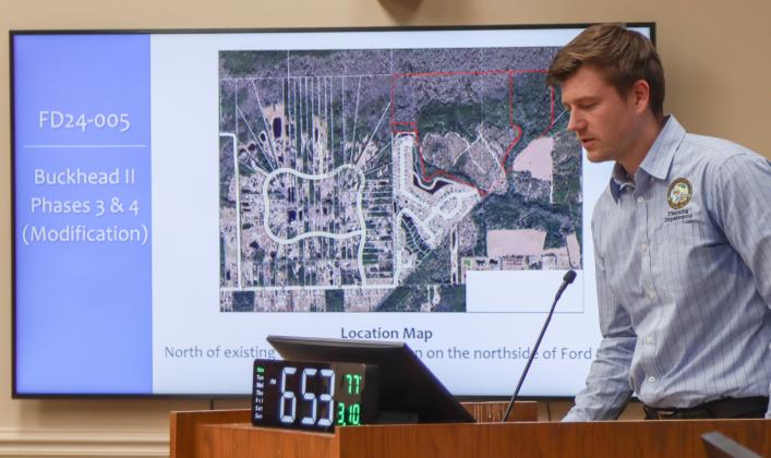 Adam Olsen of the Planning Department gives a staff presentation during the Quasi Judicial Public Hearing on March 10 over the final development plan modifications for Buckhead II Phases 3 and 4 of Buckhead Planned Unit Development. Photo by Ashley Chandler/News-Leader