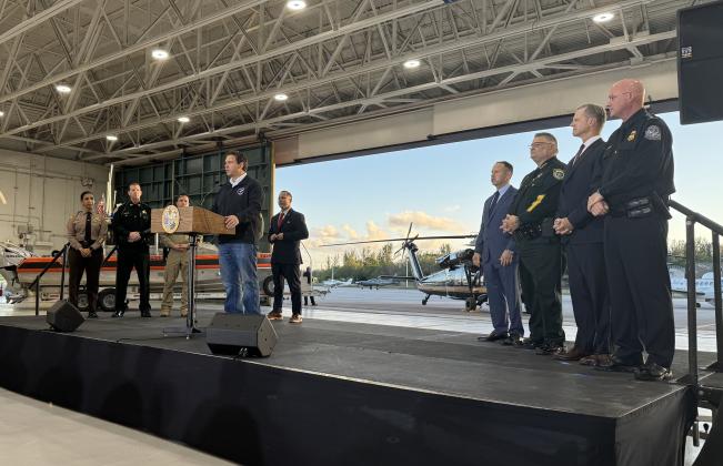 Governor Ron DeSantis speaks at a press conference with Florida law enforcement about the 287 (g) program on Feb. 26 at Homestead Air Reserve Base just outside Miami. All 67 Florida counties have entered into agreements with ICE to assist in serving warrants for those in the United States illegally. Submitted photo