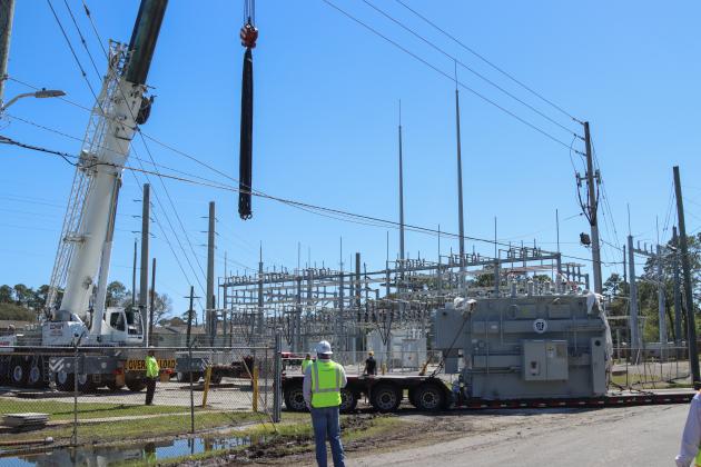 Electrical technicians and contractors work together to move a new transformer into the substation located at Lime and 10th streets. Photo by Ashley Chandler/News-Leader