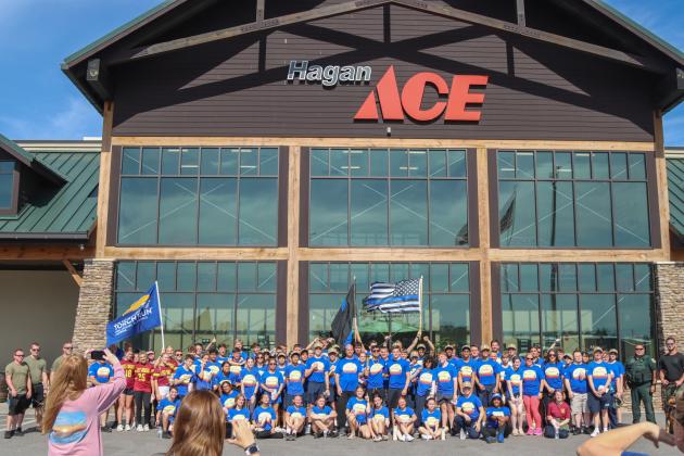 Participants in the Nassau County Sheriff's Office's Law Enforcement Torch Run posed for a photo at Hagan Ace Hardware following the completion of the 1.26-mile run. Photo by Ashley Chandler/News-Leader