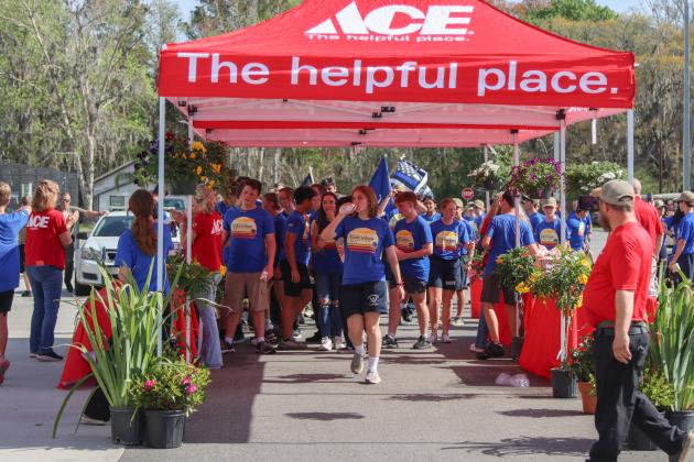 Runners in the Law Enforcement Torch Run at Hagan Ace Hardware after finishing the 1.26-mile run on Friday. Photos by Ashley Chandler/News-Leader