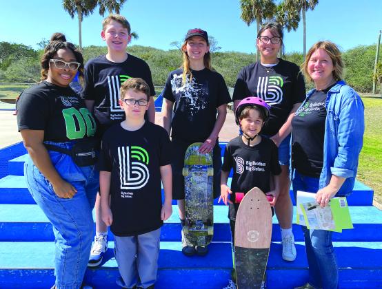 Local skateboarder Poe Pinson, center, who competed in the Paris Olympics last summer, is the first Game Changer Northeast Florida for Big Brothers Big Sisters of Northeast Florida. She is pictured at the Poe Pinson Skate Park at Main Beach March 1 with Daiserae White, director of Communications &amp; Outreach with BBBSNEFL, left; Lena Ramsay, Nassau County area manager for BBBSNEFL; and Littles Lucas, Zachary, Josi and Lola Hatton. Photo by Beth Jones/News-Leader