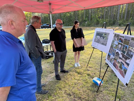 From left, Parks & Recreation Operations Manager Jason Brown, District Two Commissioner A.M. "Hupp" Huppmann, Parks & Recreation Director Jay Robertson and Kimley-Horn's Landscape Architect Analyst Hannah Miracle look at the conceptual design plan and inspiration imagery for Blackrock Cove Park at the Open House held March 27 at the site of Blackrock Cove Park, across from Crews Creek Avenue. Commissioner Jeff Gray who represents the district the park is in, also was in attendance at the event. Submitted