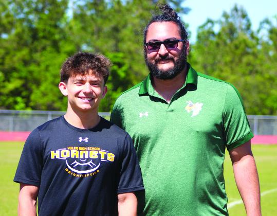 Coen Brehmer and YHS weightlifting head coach Kyle Dougherty. Photo by Beth Jones/News-Leader