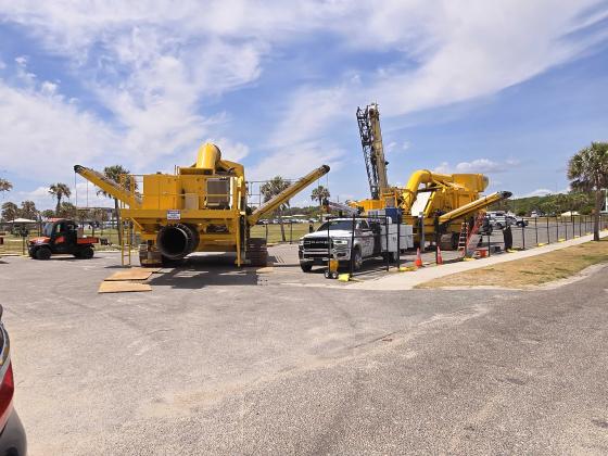 This dredging equipment is being staged in the Dolphin Parking lot at Main Beach. Photo by  Julia Roberts/News-Leader