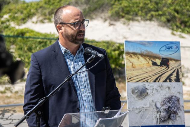 John November, attorney for Save Historic American Beach, Inc., speaks at a press conference Wednesday to discuss the lawsuit the nonprofit filed against Nassau County on Tuesday in an attempt to end beach driving at American Beach. Photo by Ashley Chandler/News-Leader