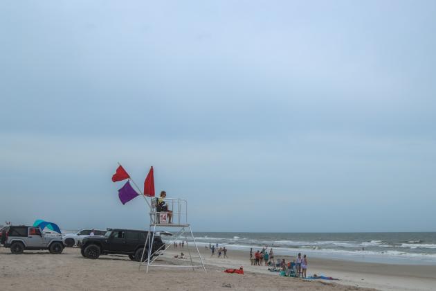 Despite the cloudy Mother’s Day weather, high hazard and dangerous marine life flags waving, Nassau County’s Peter’s Point saw many visitors Sunday. Photo by Ashley Chandler/News-Leader