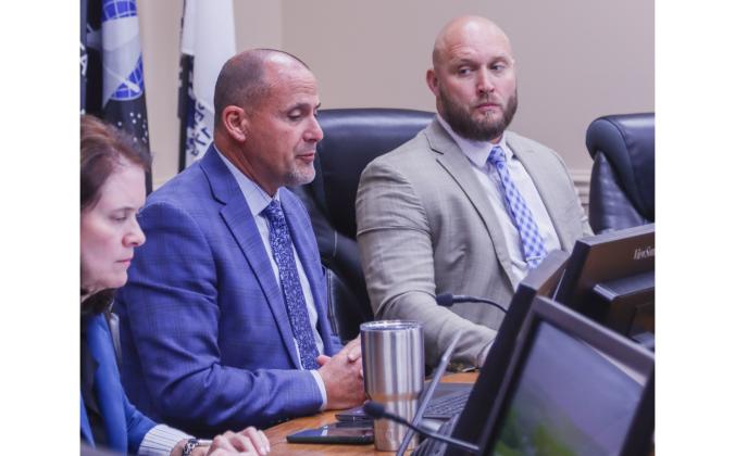 Assistant County Manager Marshall Eyerman, left, speaks at a previous Board of County Commissioners meeting as County Manager Taco Pope listens. Photo by Ashley Chandler/News-Leader