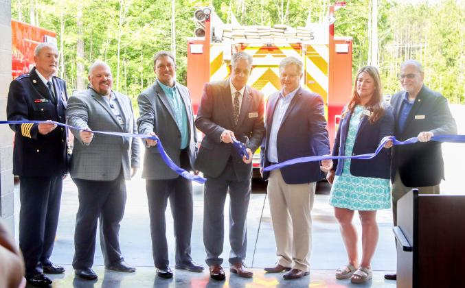 County leaders cut the ceremonial ribbon Wednesday at the ribbon-cutting ceremony for Fire Rescue Station 10. From left, Fire Rescue Chief Brady Rigdon, commissioners Klynt Farmer, Jeff Gray and A.M. “Hupp” Huppmann, President of GreenPointe Holdings, LLC, Mike Taylor and commissioners Alyson McCullough and John Martin. Photo by Ashley Chandler/News-Leader