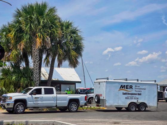 Moran Environmental Recovery was down at the Fernandina Harbor Marina on Monday to clean up a gasoline spill in the water. Photo by Ashley Chandler/News-Leader