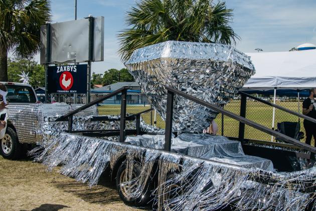 Paul Gaskins, massage therapist at the Ritz-Carlton, is the mastermind behind the resort's sparkly diamond float. He constructed it by hand for the 60th Isle of Eight Flag Shrimp Festival parade held Thursday. Photo by Ashley Chandler/News-Leader