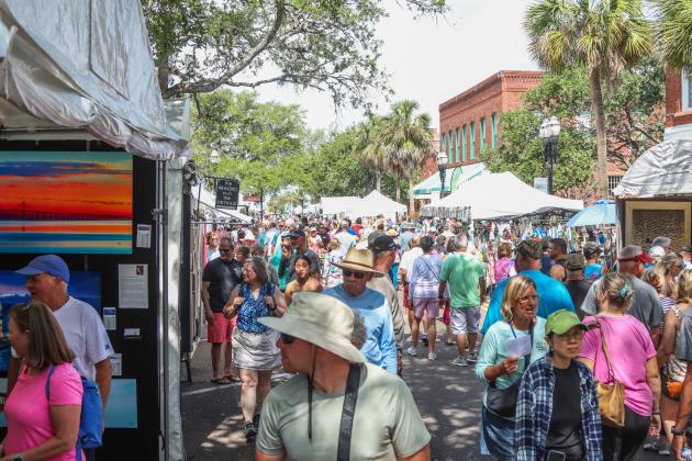 Visitors enjoy the vendors Saturday morning at the 60th anniversary Isle of Eight Flags Shrimp Festival. Photo by Ashley Chandler/News-Leader