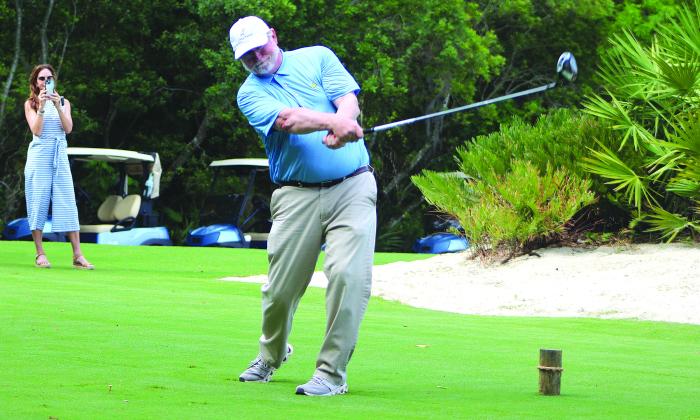 Beau Welling with the ceremonial first tee shot from the first hole at Oak Marsh during a media event Monday. Photo by Beth Jones/News-Leader