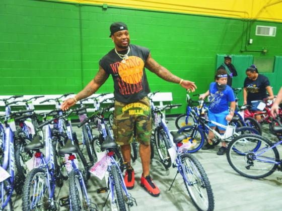 Baltimore Ravens star running back Derrick Henry and his Two All Foundation gave back to his hometown of Yulee on Saturday through a community day that included a bicycle and backpack giveaway. (MARK SHURMAN/News-Leader)