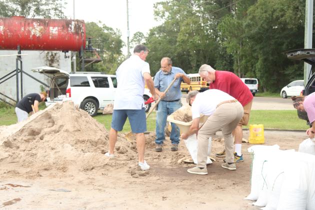 Locals fill sandbags in October at the Yulee Ballpark in preparation for Hurricane Milton. File photo
