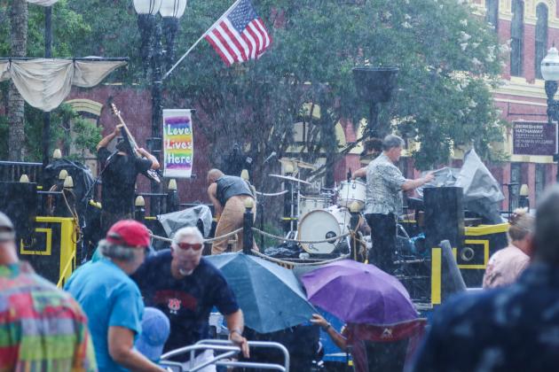 On Friday, the Sounds on Centre music series began as usual, but only three songs into Tommy Peacock’s set, the rain came crashing down on Centre Street. The concert did not resume. Photos by Ashley Chandler/News-Leader