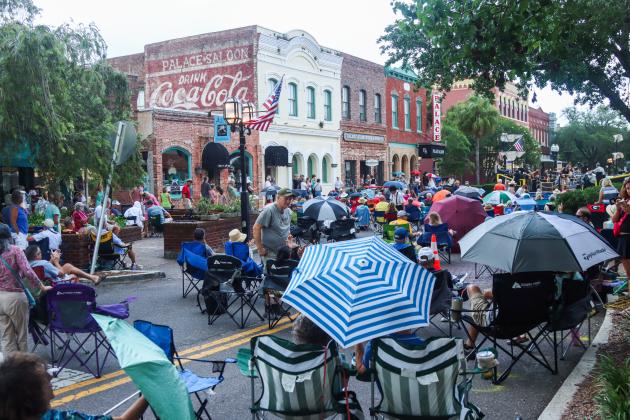 On Friday, the Sounds on Centre music series began as usual, but only three songs into Tommy Peacock’s set, the rain came crashing down on Centre Street. The concert did not resume. Photos by Ashley Chandler/News-Leader