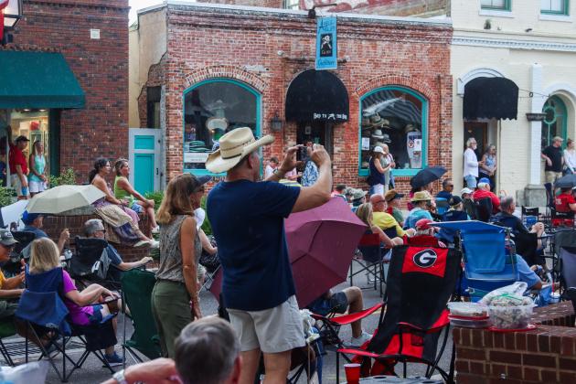 On Friday, the Sounds on Centre music series began as usual, but only three songs into Tommy Peacock’s set, the rain came crashing down on Centre Street. The concert did not resume. Photos by Ashley Chandler/News-Leader