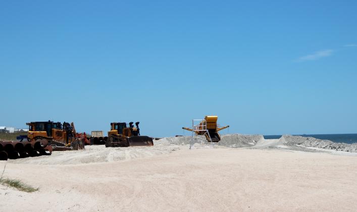 Beach renourishment at Main Beach on May 22. Photo by Ashley Chandler/News-Leader