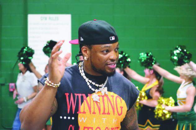 Derrick Henry, a former Yulee High star and current Baltimore Ravens star, waves to the crowd during a community day he hosted Saturday in Yulee. (MIKE THORN/Nassau County Record)