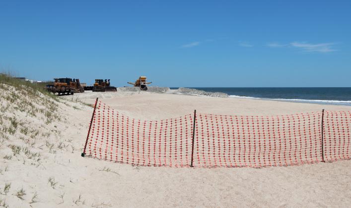 Beach renourishment at Main Beach on May 22. Photo by Ashley Chandler/News-Leader
