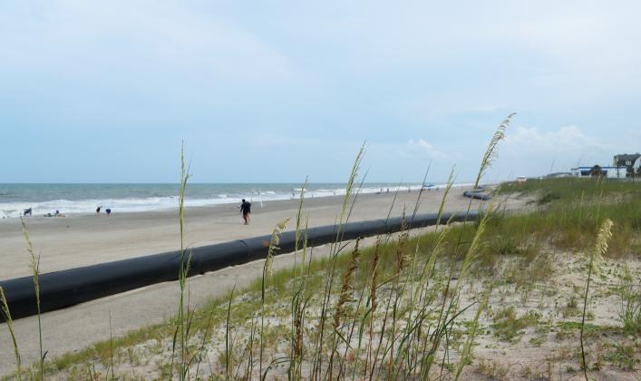 A submerged pipe is shown Wednesday running along a portion of the coastline just north of Main Beach in Fernandina Beach. Photo by Ashley Chandler/News-Leader