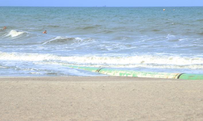 A submerged pipe is shown Wednesday running along a portion of the coastline just north of Main Beach in Fernandina Beach. Photo by Ashley Chandler/News-Leader