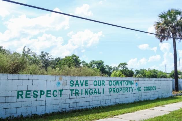 Graffiti on a retaining wall on Eighth Street reflects the opinion of many in Fernandina Beach related to the property located on 3rd and 4th streets, known as the Tringali property. Photo by Ashley Chandler/News-Leader
