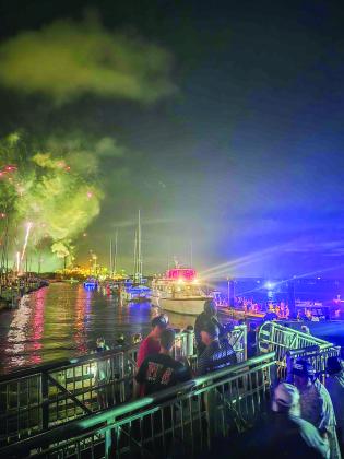 First responders at the scene of the gangway collapse as the fireworks display continues during the Hometown 4th of July Fireworks event at the Fernandina Harbor Marina. Below, the gangway is blocked off Sunday and floats had been added to keep it from falling completely into the water. Ashley Chandler/News-Leader