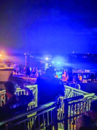 First responders at the scene of the gangway collapse as the fireworks display continues during the Hometown 4th of July Fireworks event at the Fernandina Harbor Marina. Ashley Chandler/News-Leader