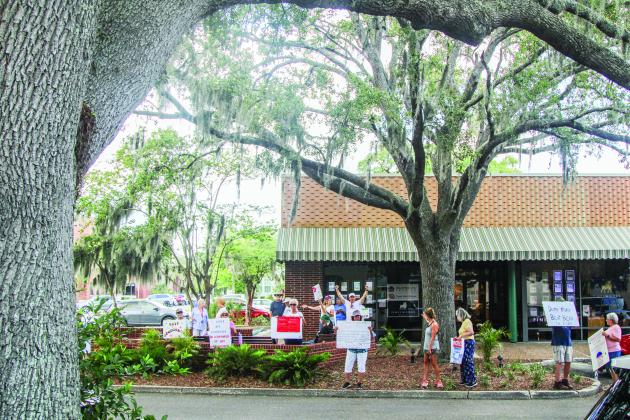Unified Nassau Florida, a nonpartisan political group in its infancy rooted in progressive values held a protest July 7 outside Congressman Aaron Bean’s local office. Photo by Ashley Chandler/News-Leader
