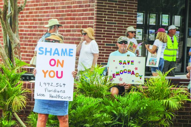Unified Nassau Florida, a nonpartisan political group in its infancy rooted in progressive values held a protest July 7 outside Congressman Aaron Bean’s local office. Photo by Ashley Chandler/News-Leader