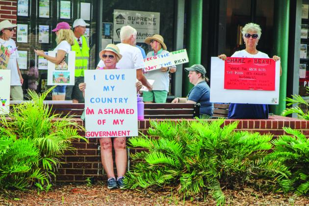 Unified Nassau Florida, a nonpartisan political group in its infancy rooted in progressive values held a protest July 7 outside Congressman Aaron Bean’s local office. Photo by Ashley Chandler/News-Leader