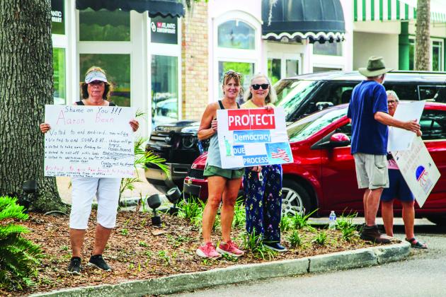 Unified Nassau Florida, a nonpartisan political group in its infancy rooted in progressive values held a protest July 7 outside Congressman Aaron Bean’s local office. Photo by Ashley Chandler/News-Leader