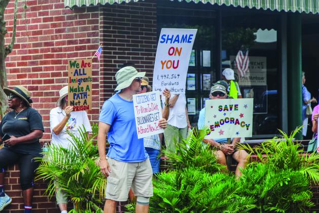 Unified Nassau Florida, a nonpartisan political group in its infancy rooted in progressive values held a protest July 7 outside Congressman Aaron Bean’s local office. Photo by Ashley Chandler/News-Leader