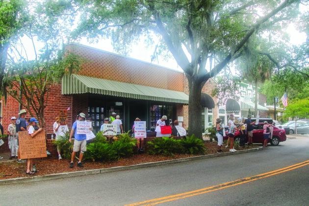 Unified Nassau Florida, a nonpartisan political group in its infancy rooted in progressive values held a protest July 7 outside Congressman Aaron Bean’s local office. Photo by Ashley Chandler/News-Leader