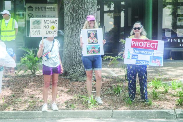 Unified Nassau Florida, a nonpartisan political group in its infancy rooted in progressive values held a protest July 7 outside Congressman Aaron Bean’s local office. Photo by Ashley Chandler/News-Leader