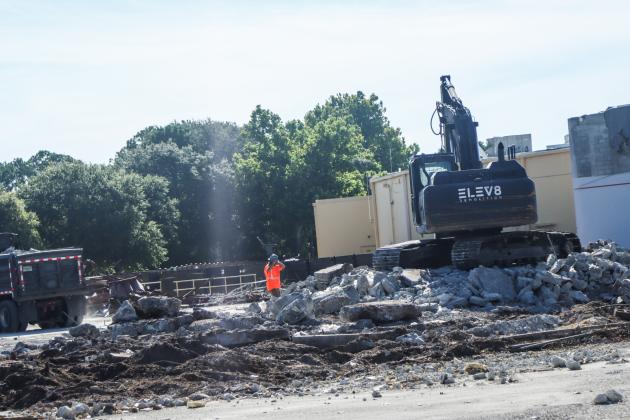 Crews work to clear debris from the demolition of The Island Walk Publix on July 8. Photo by Ashley Chandler/News-Leader