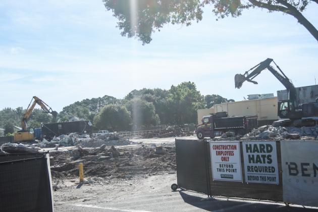 Crews work to clear debris from the demolition of The Island Walk Publix on July 8. Photo by Ashley Chandler/News-Leader